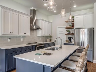 Kitchen featuring a sink, stainless steel applianc
