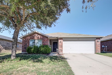 Ranch-style home featuring concrete driveway, brick siding, a garage, a front lawn, and a shingled roof