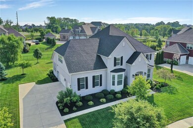 The bright brick exterior is accented by stately black shutters.