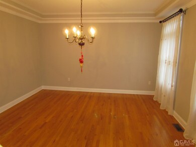 FORMAL DINING ROOM WITH TRAY CEILING.