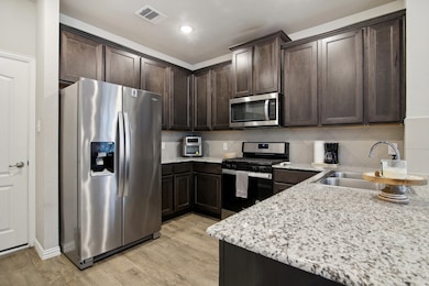 Featuring stainless steel appliances, with the ref