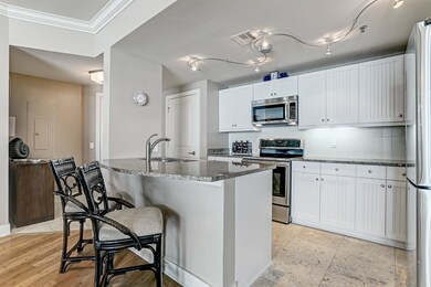 The kitchen includes a breakfast bar as well for e