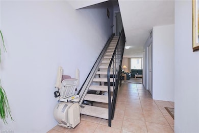 Stairs with tile patterned flooring