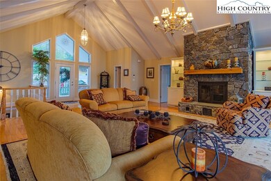 The stone fireplace is flanked by built-in cabinet