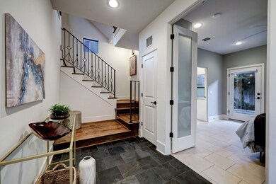 Foyer entrance with slate tile floor and view of t