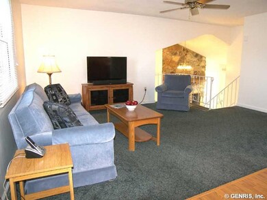 Living Room Living room is open to the foyer below
