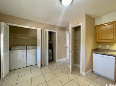 Laundry area featuring separate washer and dryer, 