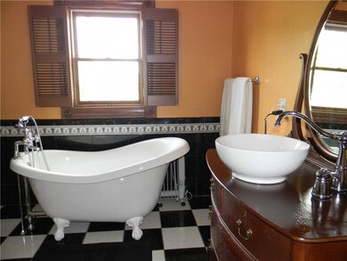 Main bath with doomed ceiling, claw foot tub and c