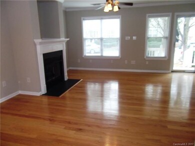 Living room with hardwoods floors and gas fireplac