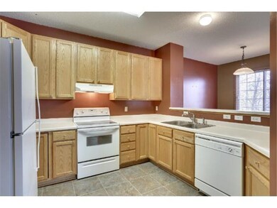 Nicely laid-out kitchen is neutral and ready for d