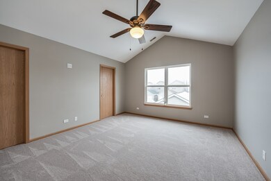Fresh paint & new carpet in the master bedroom, also featuring a large walk-in closet and vaulted ceiling