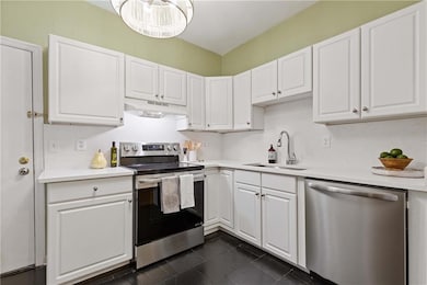 Recently Renovated with new Quartz countertops, backsplash, stainless appliance package, faucet and lighting