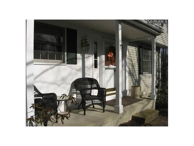 Quaint front porch greets family and friends.