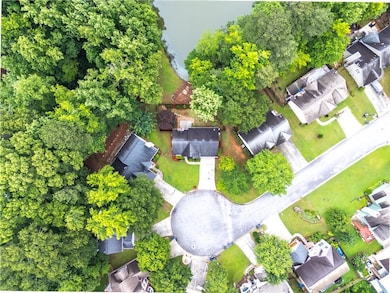 Aerial overview of property's location with nearby suburban area
