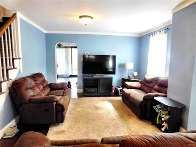 Enter into sunny living room with hardwood floors!
