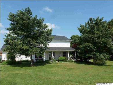Back Picture of the house with Covered Back Porch area.