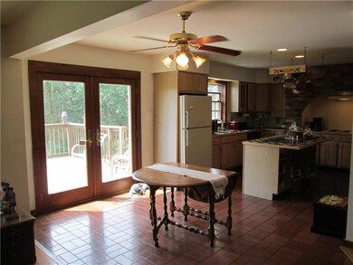 Eat in kitchen with French doors that lead to 16x1