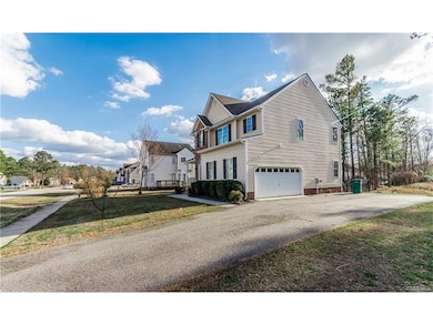 Right side of home - 2-car garage and large parkin