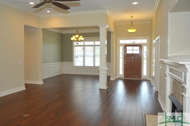 View of the dining room and foyer from the great r