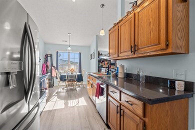 Kitchen with sink, a textured ceiling, decorative 