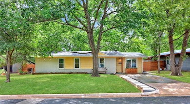 Single story home featuring brick siding