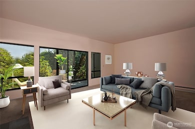 Large, quiet living room with lots of natural light adjoins the sunroom.  It has 9