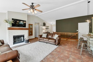 A cozy gas fireplace in the great room is perfect 