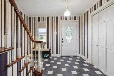 VERY NICE FOYER WITH REAL WOODEN STAIRS