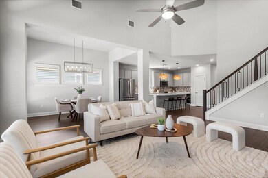 Living room featuring baseboards, dark wood-style