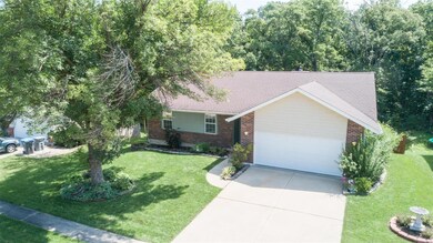 Look at the beautiful ranch home backing to thick 