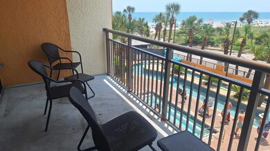 Balcony featuring a water view and view of pool