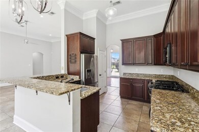 The beautiful kitchen that's partly tucked off and partly a part of the open full plan.
