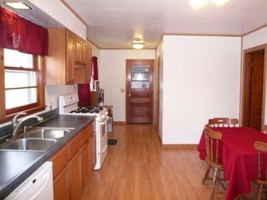 View of kitchen from living room.  Seller added a finished laundry room on the right side.