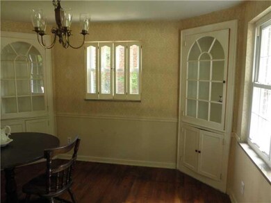 Dining Room. EXPOSED HARDWOOD FLOOR AND BUILT-IN C