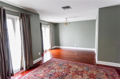 As you enter the home, gorgeous wood floors welcom