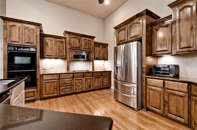 Beautiful, Rich Cabinets Galore in this Open Spaci
