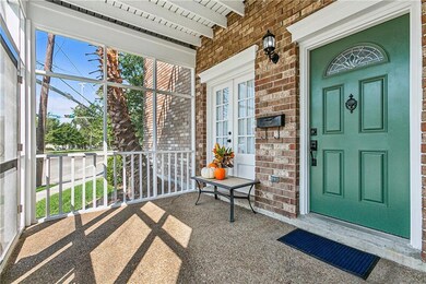 Inviting screened-in porch with a stylish green fr