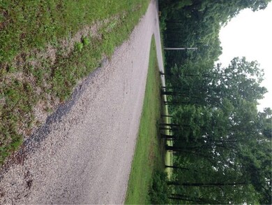 Property on left side before curve of Oaks Landing