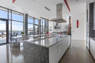 Kitchen with island exhaust hood, visible vents, 