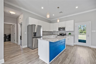 KITCHEN OVERLOOKS DINING