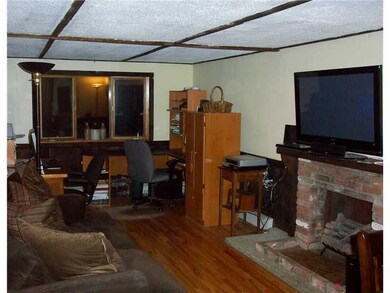 Living Room. Cozy living room with hardwood floor!