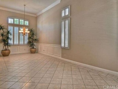 Formal Dining Room has large windows accented by p