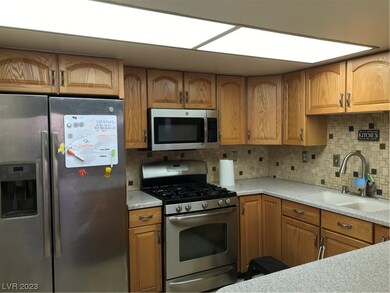 The spacious kitchen has tons of storage, is adjac