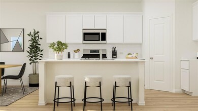 Kitchen with backsplash, a breakfast bar area, light wood-type flooring, and stainless steel appliances