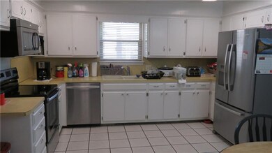 Large kitchen with newer appliances.