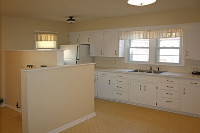 Notice laundry conveniently located behind dividin