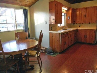 Alternate view of kitchen with wood ceiling and di