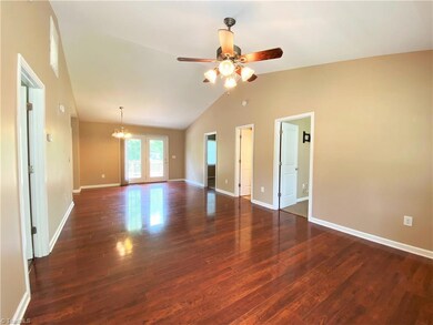 Additional view of living room and dining area