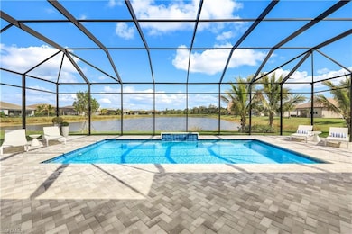 View of swimming pool featuring a water view, a la