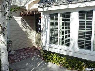 Charming brick sidewalk to front door.